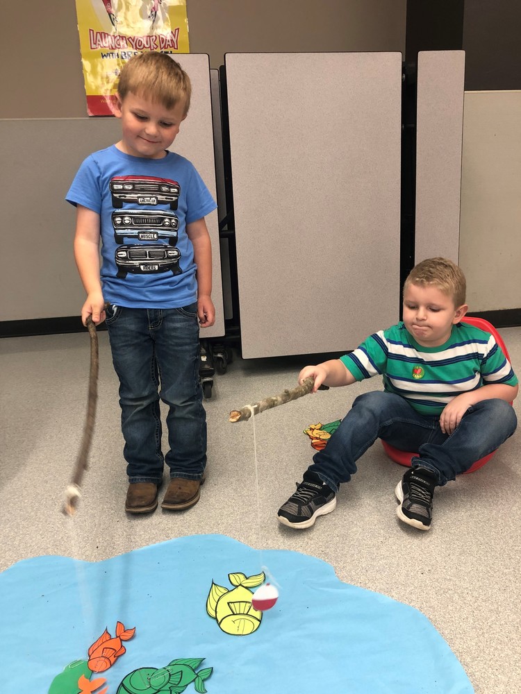 Kindergartner's fishing for paper fish